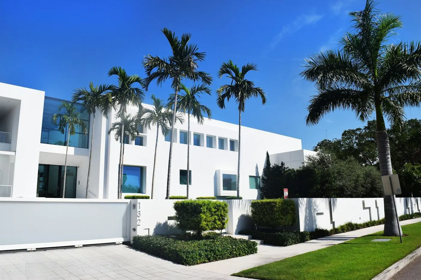 View of palm trees and a bright Florida sky through a window