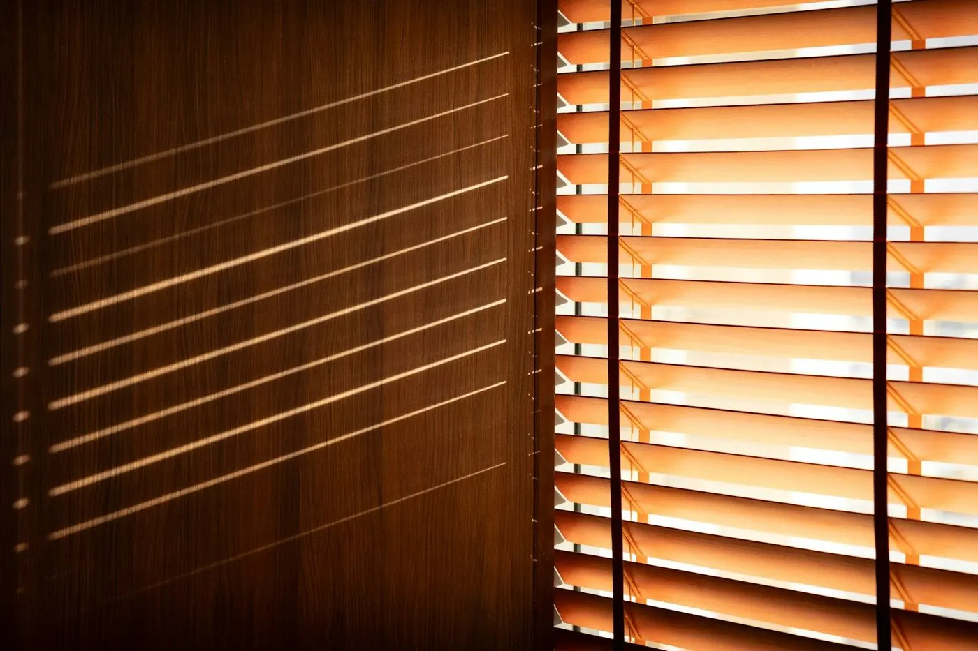 Wood blinds with sunlight coming through