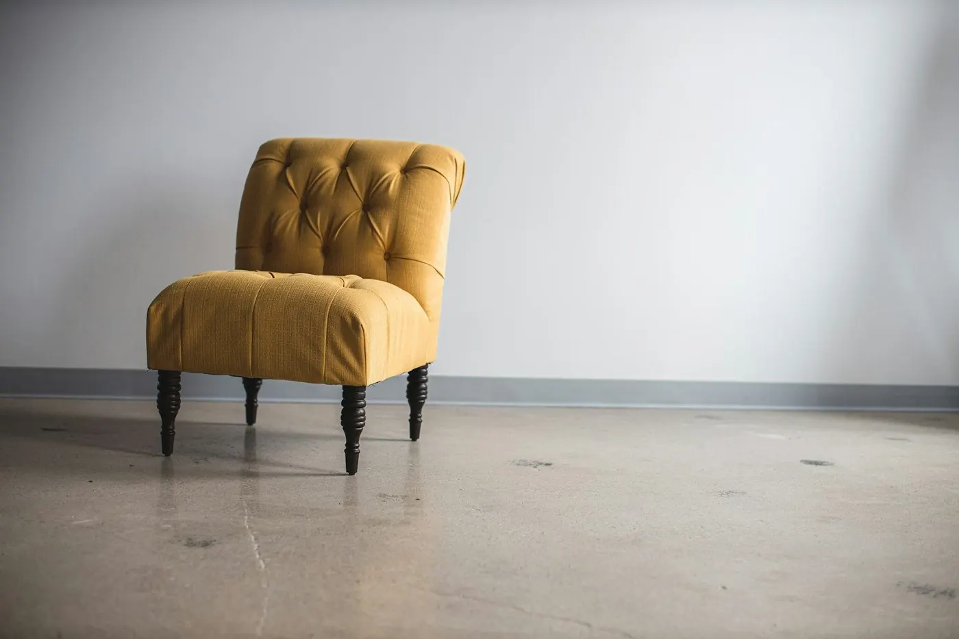 Tufted mustard upholstered chair